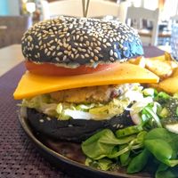 This burger at Bhajan was impressive: my first charcoal burger, a savoury patty and a great side salad. at Bhajan Cafe in Riga