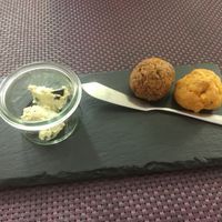 Free starters. Little bread ball with olive pate  at Bhajan Cafe in Riga