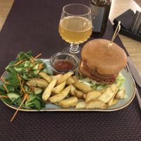 Big Burger with Salad and Potato Wedges  at Bhajan Cafe in Riga