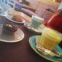 Safire and golden latte with som sweets at Bhajan Cafe in Riga