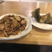 Rice with jackfruit curry and two different vegan sausages, and sticky rice with beans in banana leaf. All together: 100 baht.  at Im Jai - Veg Food Stall in Chiang Mai