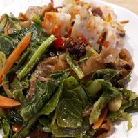 Wide noodles and greens plate with steamed radish cake! at Im Jai - Veg Food Stall in Chiang Mai