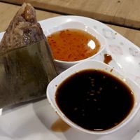 Rice wrap with sauce on the side at Im Jai - Veg Food Stall in Chiang Mai