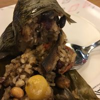Sticky rice in a banana leaf with seitan, peanuts, lotus beans, etc. for 30 baht  at Im Jai - Veg Food Stall in Chiang Mai
