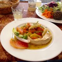 Hummus with oven-baked vegetables and bread.  at Huber in Freiburg