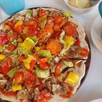 Vegan pizza with cashew & tofu cheese on the side. Really good👌 at Peppermaint Guesthouse in Chiang Mai