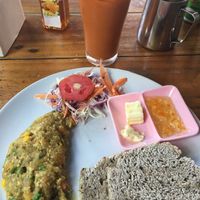 Vegan omelette, whole-wheat bread, jam & Thai(coconutmilk) iced tea for 100 baht. So so good! at Peppermaint Guesthouse in Chiang Mai