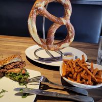 Bavarian Pretzel, side of sweet potato fries and 1/2 of beyond burger. at Yard House in Fresno