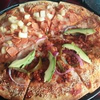 half Hawaiian half Mexican pizza  at U.to.pi.a in Mexico City