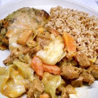 brown rice with seitan+veggies mix in peanut sauce and cabbage rolls with spinach and chickpea filling. at Salpicos Verdes in Porto