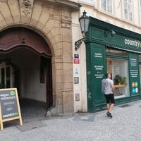 Enter via the courtyard to the right of the shop at Country Life Restaurant in Prague