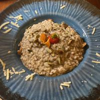 Wild mushroom risotto - cheese (unsure if vegan or lacto) was sprinkled around the perimeter of the plate!!!!  at Matoni in Split