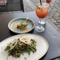 Bruschetta, tempeh sticks w/ peanut sauce and a strawberry lemonade with vodka. Sooo good! at simpleRAW in Copenhagen