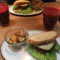 Vegan burger + beet juice with a side of potatoes at simpleRAW in Copenhagen