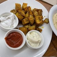 Patatas bravas with vegan dips  at Fang i Aram in Menorca