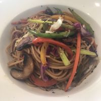 Vegan wok dish €11.95
(noodles, vegetables, portobello mushrooms, soy sauce
and ginger oil) at Fang i Aram in Menorca