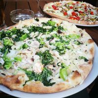 Cream-based and traditional tomato sauce based vegan pizzas at Pizzeria Manna in Prague