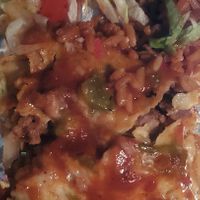 Vegan Enchilada Plate: Impossible meat, vegan cheese, refried beans, rice, red and green chili sauce at La Salita in Albuquerque
