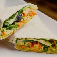 Hummus wrap (with grated carrot, black olives, cucumber, ruccola and pesto). at The Goat Herder in Budapest