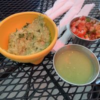 Side of chips (not shown) with guacamole and two sides of salsa that we chose. at Gringo A Go Go in Raleigh