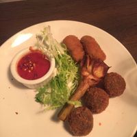 App of eggplant meatballs, fried artichoke, rice balls  at Civico 1845 in San Diego