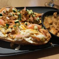 Hoy honey chicken on pretzel bun at The Burrowing Owl in Colorado Springs