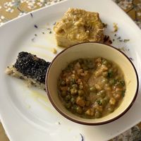 Polenta and tempeh/veggie dish with baked sweet potato   at Fram Cafe in Bologna