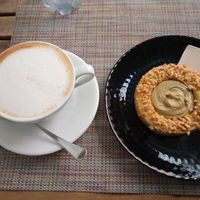 This tahini cookie with a pistachio cream filling is heavenly. Might be my favorite thing here. at Fram Cafe in Bologna