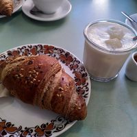 Iced caffe latte and plain croissant at Fram Cafe in Bologna