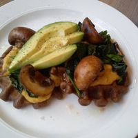 buckwheat waffles with sweet potato hummus mushrooms spinach and avocado 
with a pinch of himalayas sea salt and black pepper  at Think Love Juices & Vegan Food in Warsaw