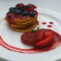 Good looking and tasting pancakes and red fruits at Think Love Juices & Vegan Food in Warsaw