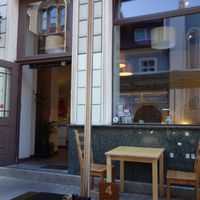 Ahimsa - view from the outside. There are more bigger tables where you could sit with up to 8/10 people (depends on how close you want to be ;) ) at Urban Vegan - Online in Wroclaw