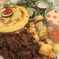 Vegan kebab, turmeric bread, potatoes and salad at O'Vita in Parma