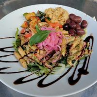 Salad : hummus, pasta, pickled onions, chickpeas, olives, rocket, pickled cucumber with chilli, etc. at Crippas Cafe in Gothenburg