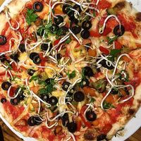 Vegan pizza at Kavarna Klubu Cross in Prague