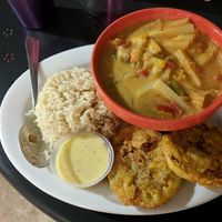 Palmitos en Coco(Gluten Free & Soy Free) - Hearts of palms, onions and bell peppers in coconut milk, served with white rice & tostones. at Equelecua Cuban Cafe - Cloud Kitchen in Los Angeles