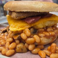 Breakfast bagel - beans, mushrooms, hash browns, cheese, vegan b*con and sausages at Blondes in Cottingham
