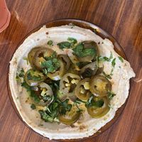Hummus with pickled jalapeños   at Love and Peas in The Hague