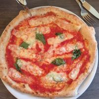 vegan cheese and basil on wheat crust at Jurgis ir Drakonas in Vilnius