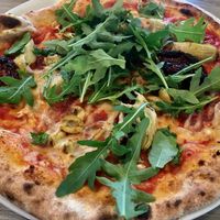 Vegan pizza with wholewheat crust at Jurgis ir Drakonas in Vilnius