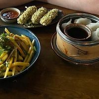 Mango salad, tofu with green rice and dumplings at Soy in Berlin