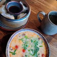 Coconut soup and dumplings at Soy in Berlin