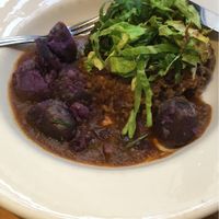 Vegan Haggis with purple potatoes and red wine gravy at Henderson's Vegan in Edinburgh