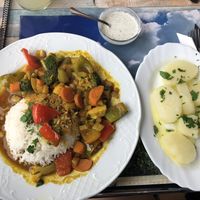 Indian rice and vegetables with curry, and potatoes with oil, parsley and garlic! at La Frontera in Fisterra