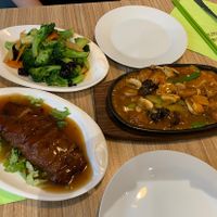 Mock duck, fried chicken and a broccoli dish  at Vege Saveurs in Paris