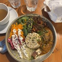 Whole food bowl and spiced apple juice  at Veggie Vie in Adelaide