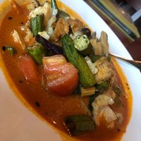 Red Curry - Does not contain butter. Just coconut milk. I asked thrice :) at Rasa Sayang in Wilmington