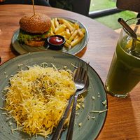 Pasta with cheese sauce and cheeseburger/fries at Kiwi Vegan Cafe in Tbilisi