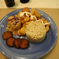 Dinner of the day, vegan sausage, fried potatoes with aioli, couscous and rice.  at Casa Griega in Barcelona