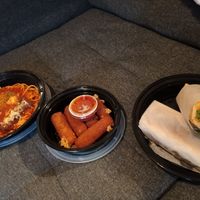 Left to right: mock chicken Parm over spaghetti, vegan mozzarella sticks, and fried zucchini hoagie! at Triangle Tavern in Philadelphia